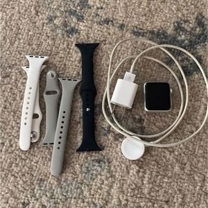 Series 1 38 mm Apple Watch. Comes with bands and charger